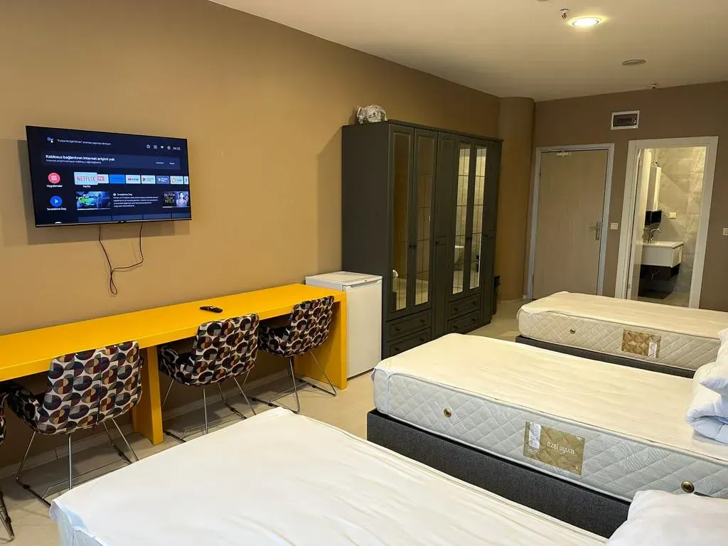 Furnished bedroom with TV and wardrobe in Maslak residence