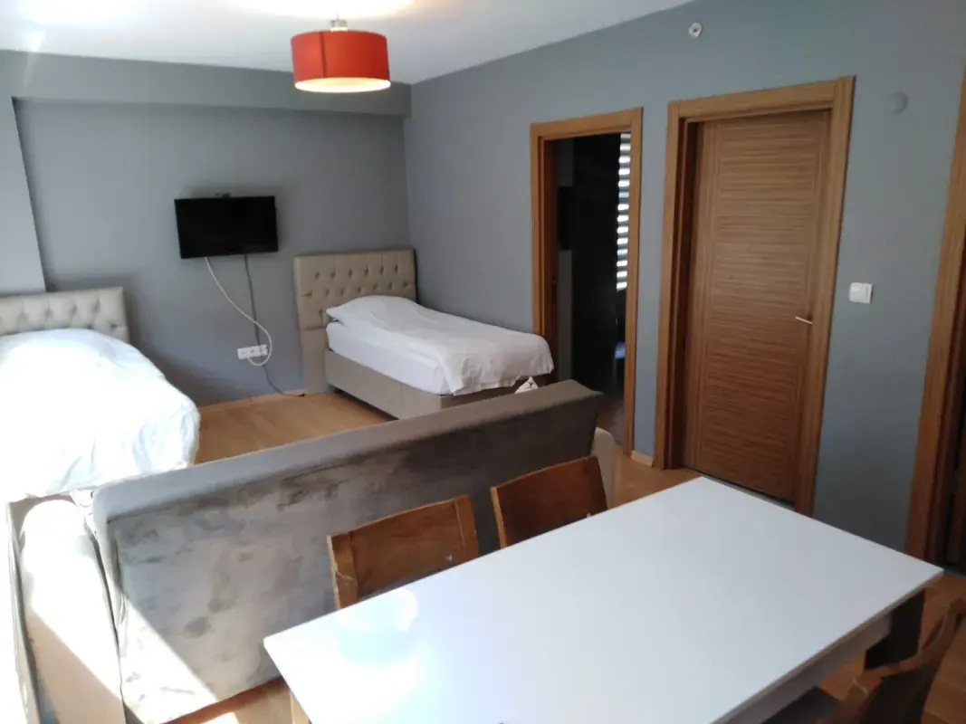 Shared bedroom containing two separate beds and study table