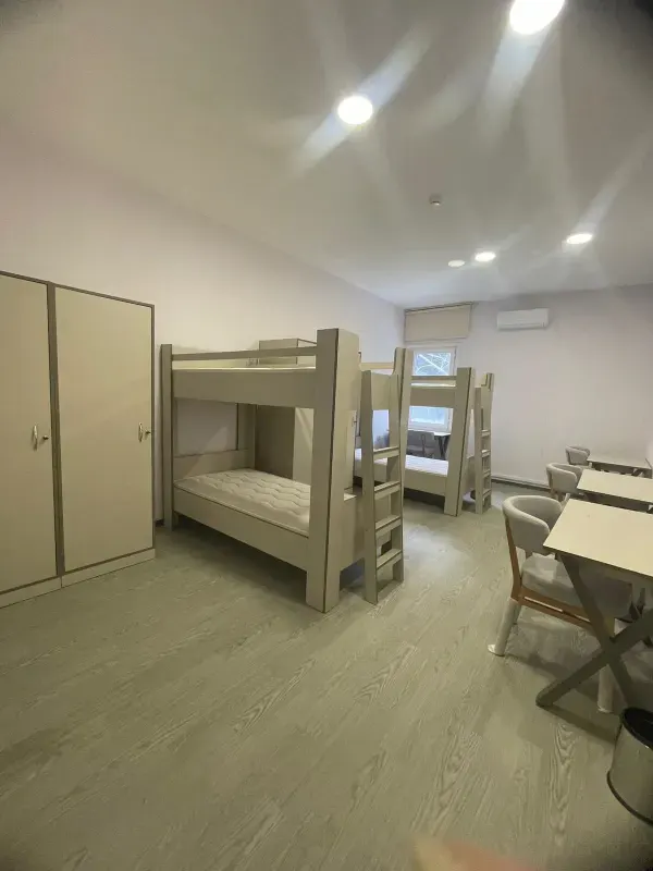 Student shared room containing beds and study desks