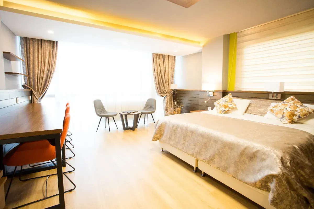 Shared bedroom with comfortable beds and desk