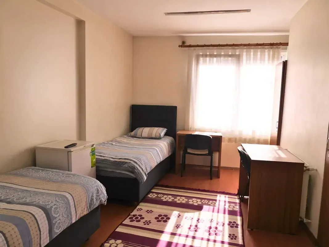 Shared room for two people containing two separate beds in Fatih residence
